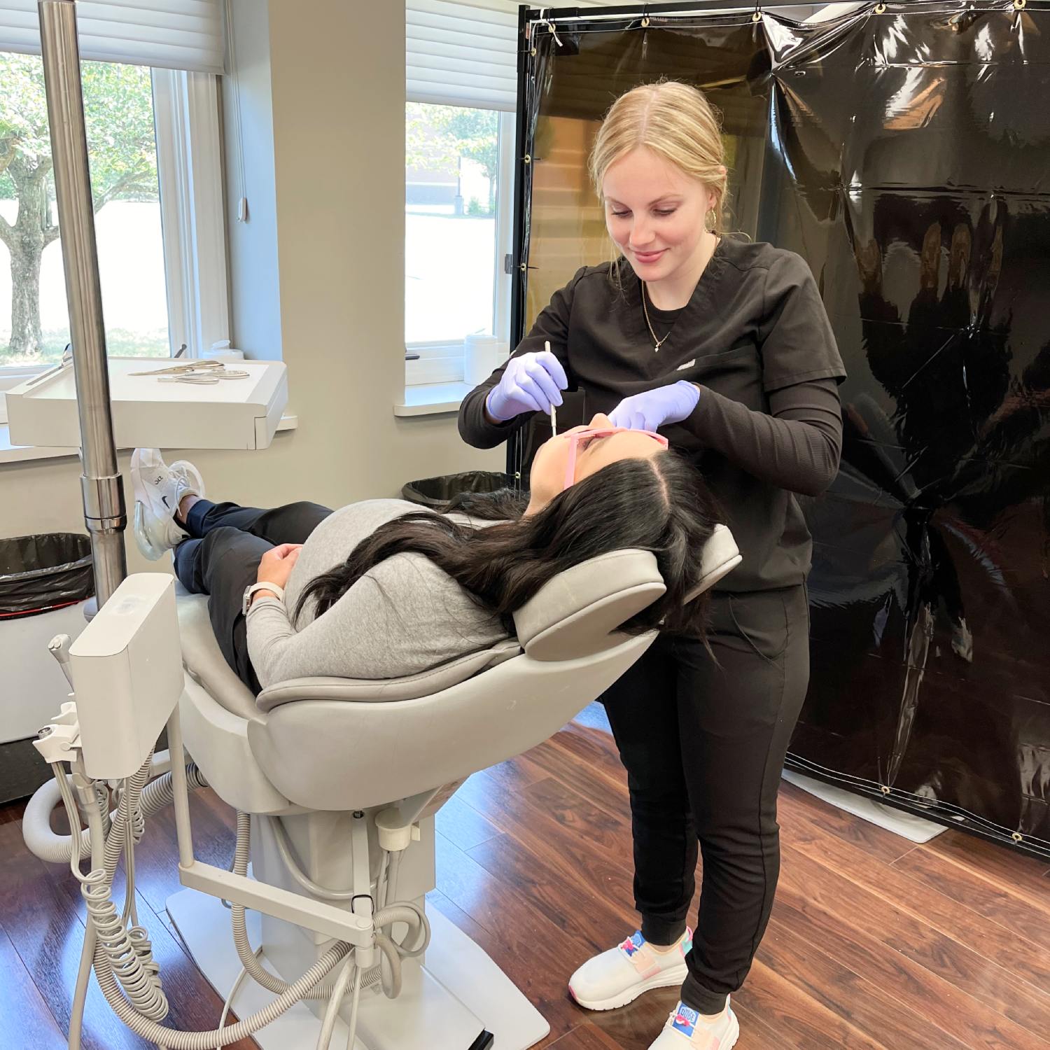 Orthodontic Associates staff working with patient